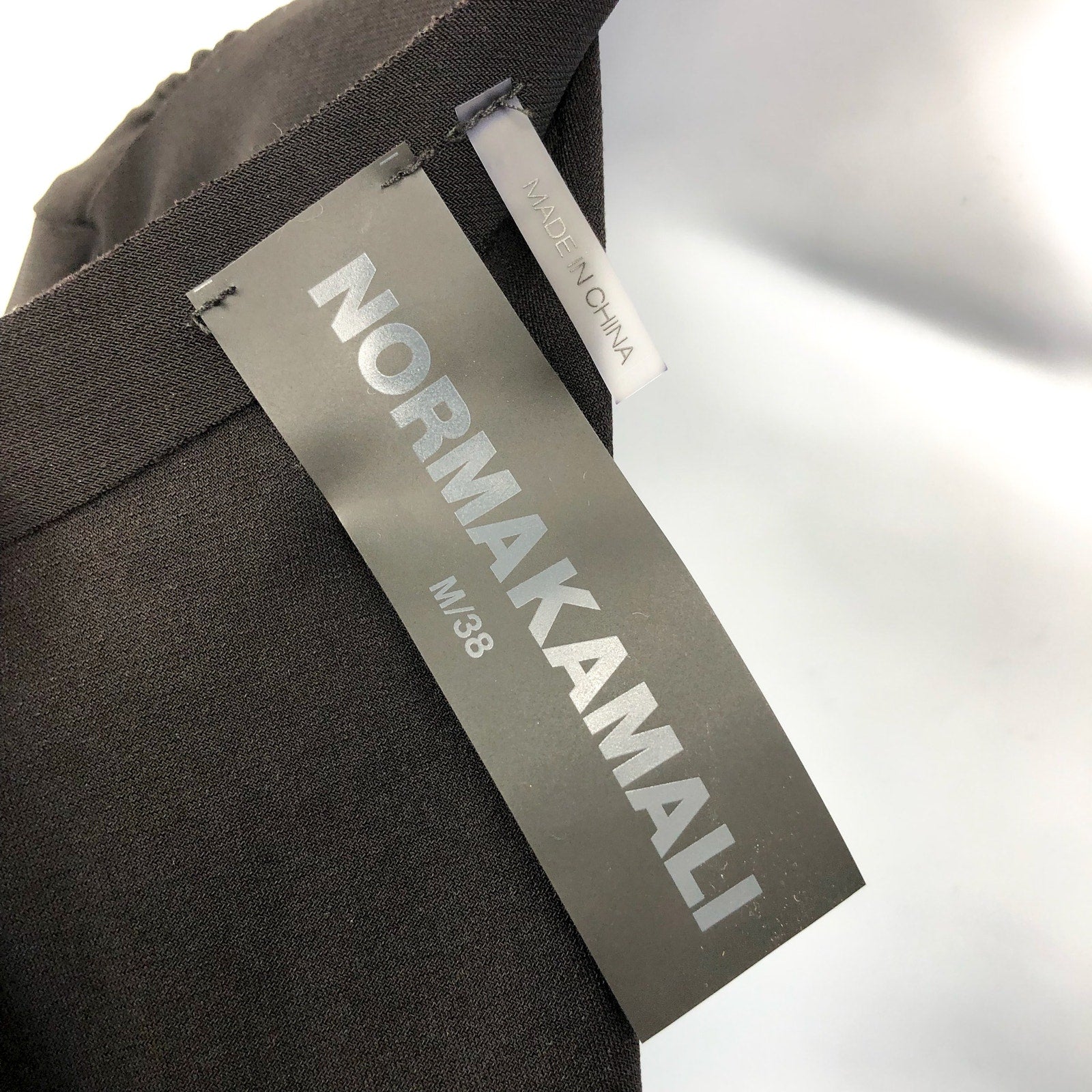 NORMA KAMALI V-Neck Shirred Waist Jumpsuit Medium 38 Black Long Sleeve NWT