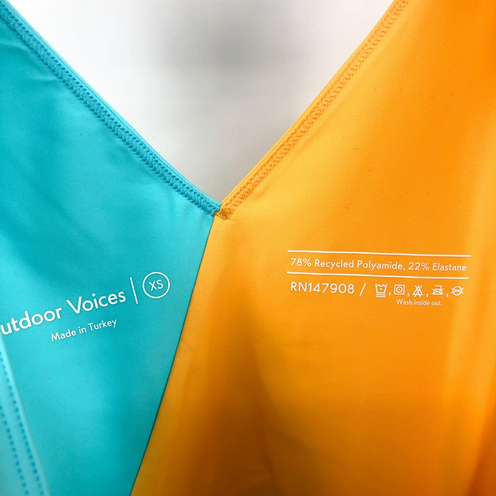 OUTDOOR VOICES Women SplashKnit 6" Bodysuit XS Colorblock Black Teal Yellow NWT